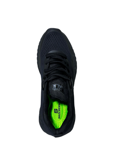 A black Skechers running shoe shown from a top-down view, featuring a bright neon green inner lining with the Skechers logo.