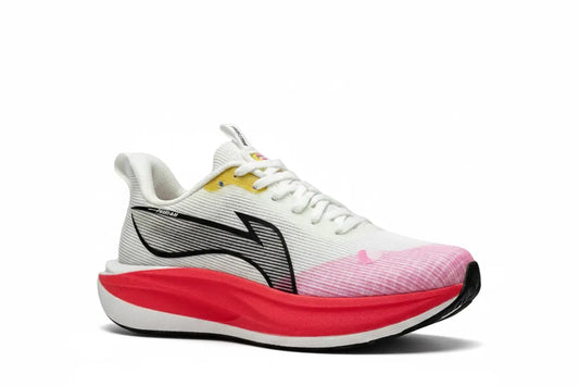 A white running shoe with a thick red and white midsole, a pink textured toe box, a black and gray side logo, and a small yellow accent near the collar, shown on a white background.