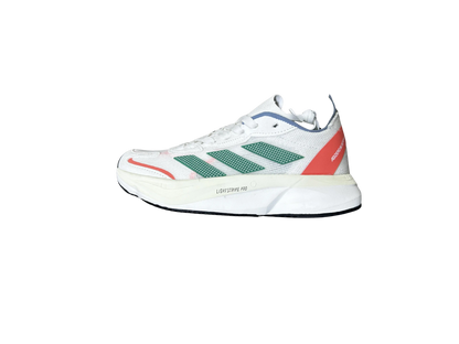 A white Adidas x Soma running shoe featuring green three-stripes, a coral-red heel tab, and a thick white midsole with 'LIGHTZONE PRO' text, shown against a plain white background.
