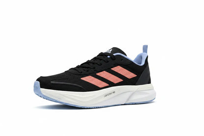 A black Adidas running shoe with coral pink three-stripes, a white midsole, and light blue accents on the outsole and heel pull tab, shown against a plain white background.