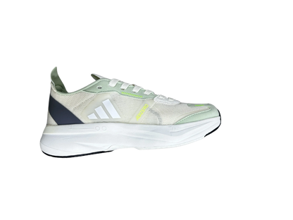 An Adidas running shoe in a light cream and mint green colorway, featuring white stripes, a dark navy heel accent, and a thick white midsole, shown from a side profile on a white background.