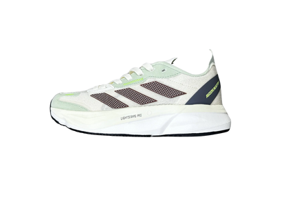 A single Adidas running shoe shown from the side against a plain white background. The shoe features a white and light green upper with dark brown mesh stripes, a dark green heel counter, and a thick white midsole.