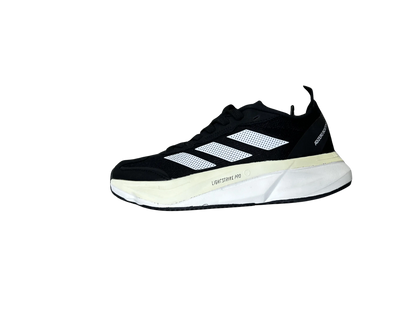 A single Adidas Lightstrike Pro running shoe in black and white, shown from a side profile view against a plain white background.