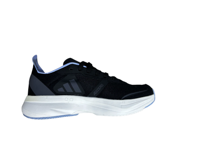 A single athletic shoe shown in side profile against a plain white background. The upper is predominantly black with a thick white midsole and small light blue accents along the heel and outsole edge.