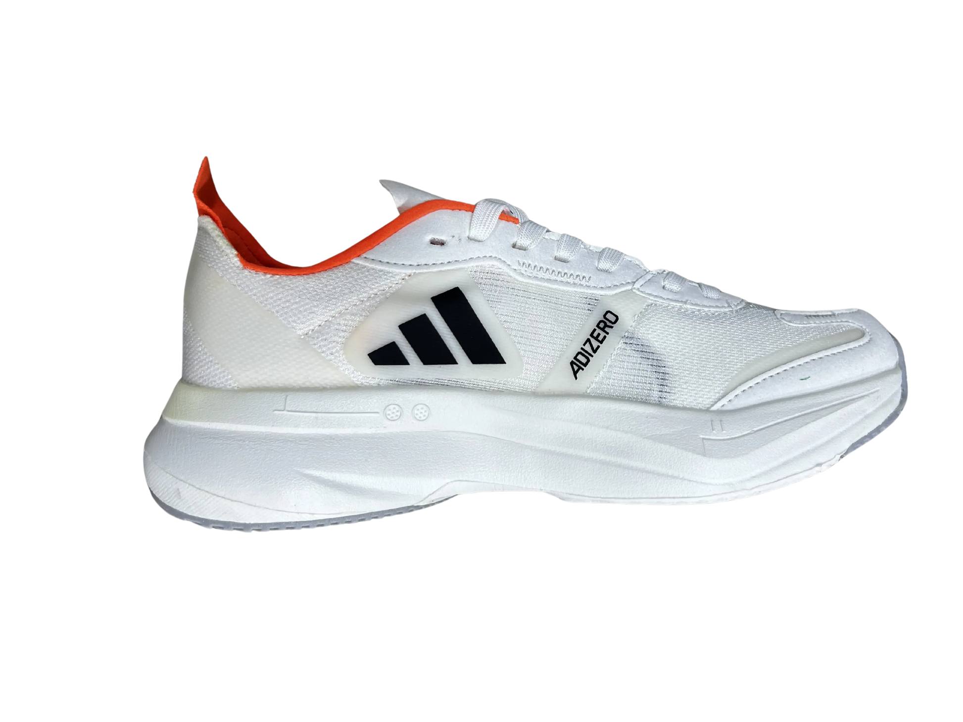 A white Reebok athletic shoe shown from a side profile view against a solid white background, featuring a black logo and a bright orange pull tab.