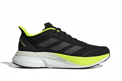 An Adidas Lightstrike Pro running shoe in black with bright neon yellow-green accents on the collar, tongue, and midsole, set against a plain white background.