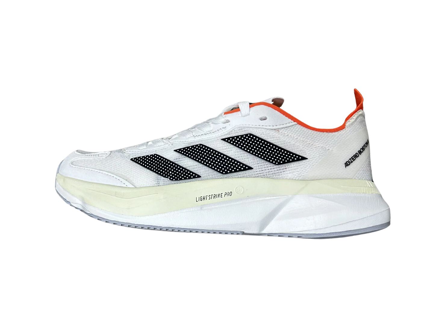 A white Adidas running shoe shown in a side profile view against a plain white background, featuring black three-stripes, a cream midsole, and orange accents.