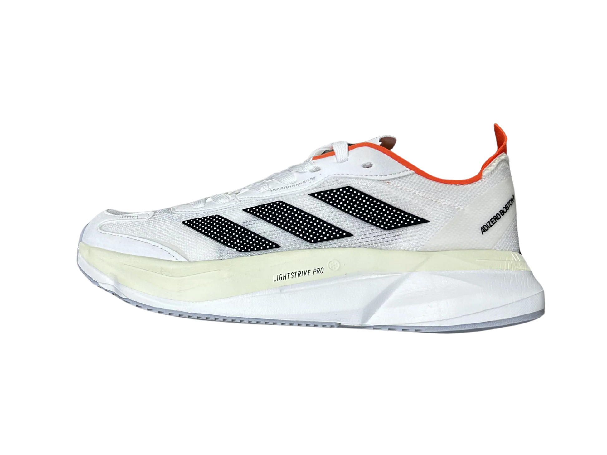 A white Adidas running shoe shown in a side profile view against a plain white background, featuring black three-stripes, a cream midsole, and orange accents.