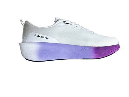 A white low-top sneaker with a thick platform sole featuring a purple gradient, shown from the side on a white background. The side of the shoe displays the 'zoomX' branding.