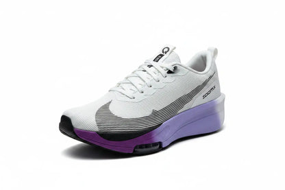 A Nike running shoe in white with a purple midsole and purple toe cap, featuring a black swoosh and black outsole.