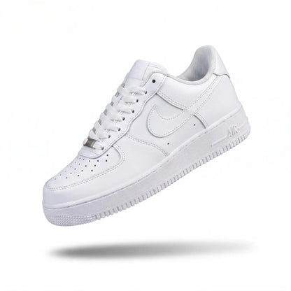 A classic white Nike Air Force 1 sneaker shown floating at an angle against a clean white background with a soft shadow underneath.