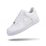 Triple white low-top sneaker side view