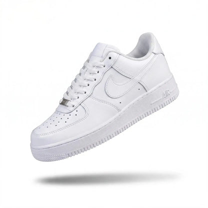Triple white low-top sneaker side view