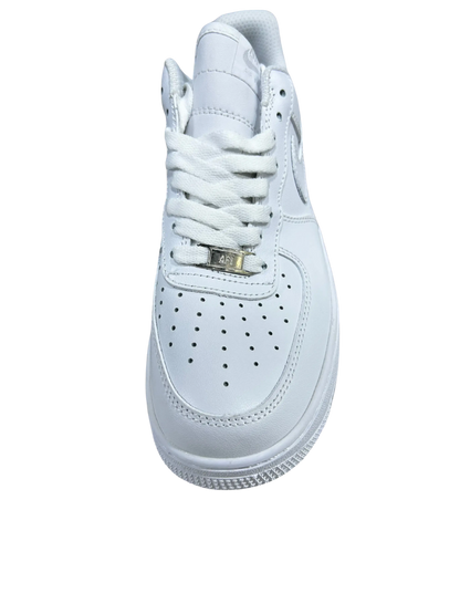 A white leather high-top sneaker with white laces and a small gold metal accent on the lacing system, shown from a top-down view on a white background.