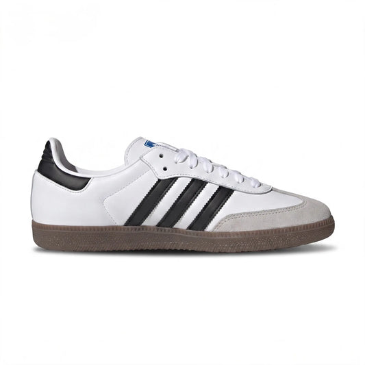 A classic Adidas Samba sneaker in white leather with black three-stripes, a black heel tab, white laces, and a brown gum sole, shown in a side profile on a white background.