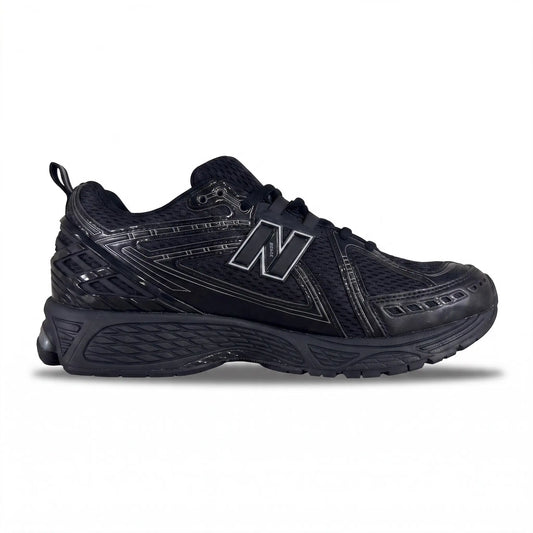 A low-top athletic shoe in olive green and dark gray with a textured patterned upper, a large beige geometric logo on the side, and a dark sole, shown against a neutral gray background.