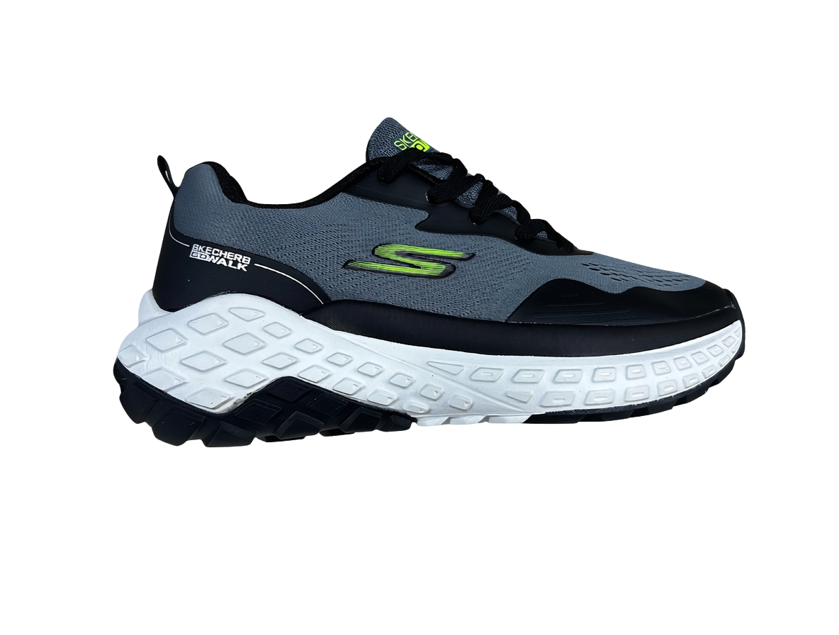 A Skechers running shoe shown from a side profile view, featuring a dark gray and black upper with a prominent white midsole and a bright green logo accent.